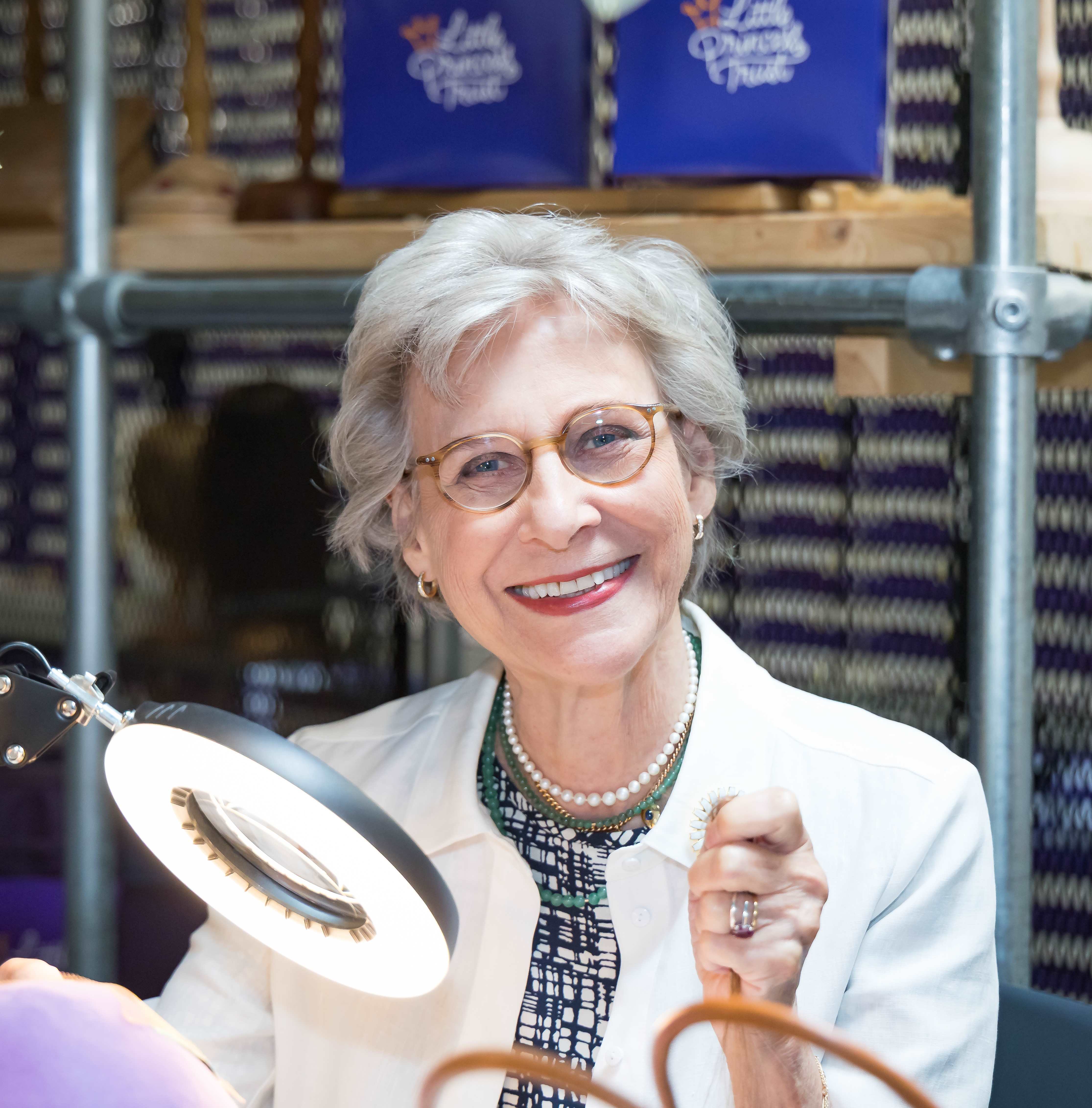 Duchess of Gloucester tries wig-knotting at The Little Princess Trust