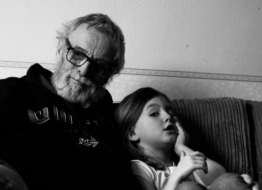 Caly Doughty with her granddad Pete Doughty.   Pictured above: Caly and her family take part in the 12-hour car challenge.