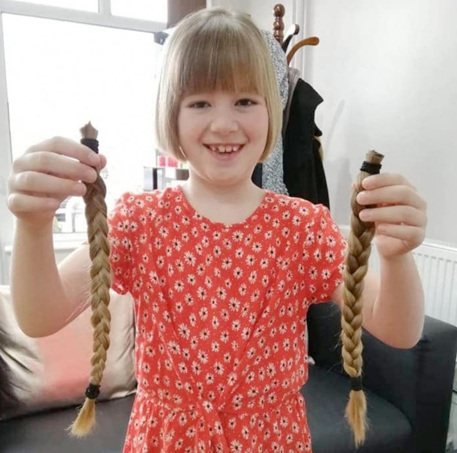 Caly with the hair she donated to The Little Princess Trust.