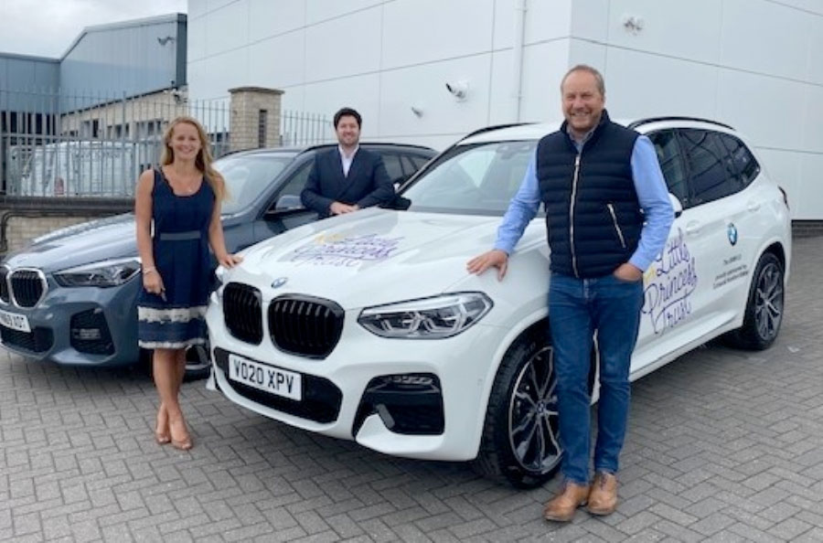 Wendy Tarplee-Morris and Phil Brace (right) thank Steve Liddle at BMW Cotswold Hereford.