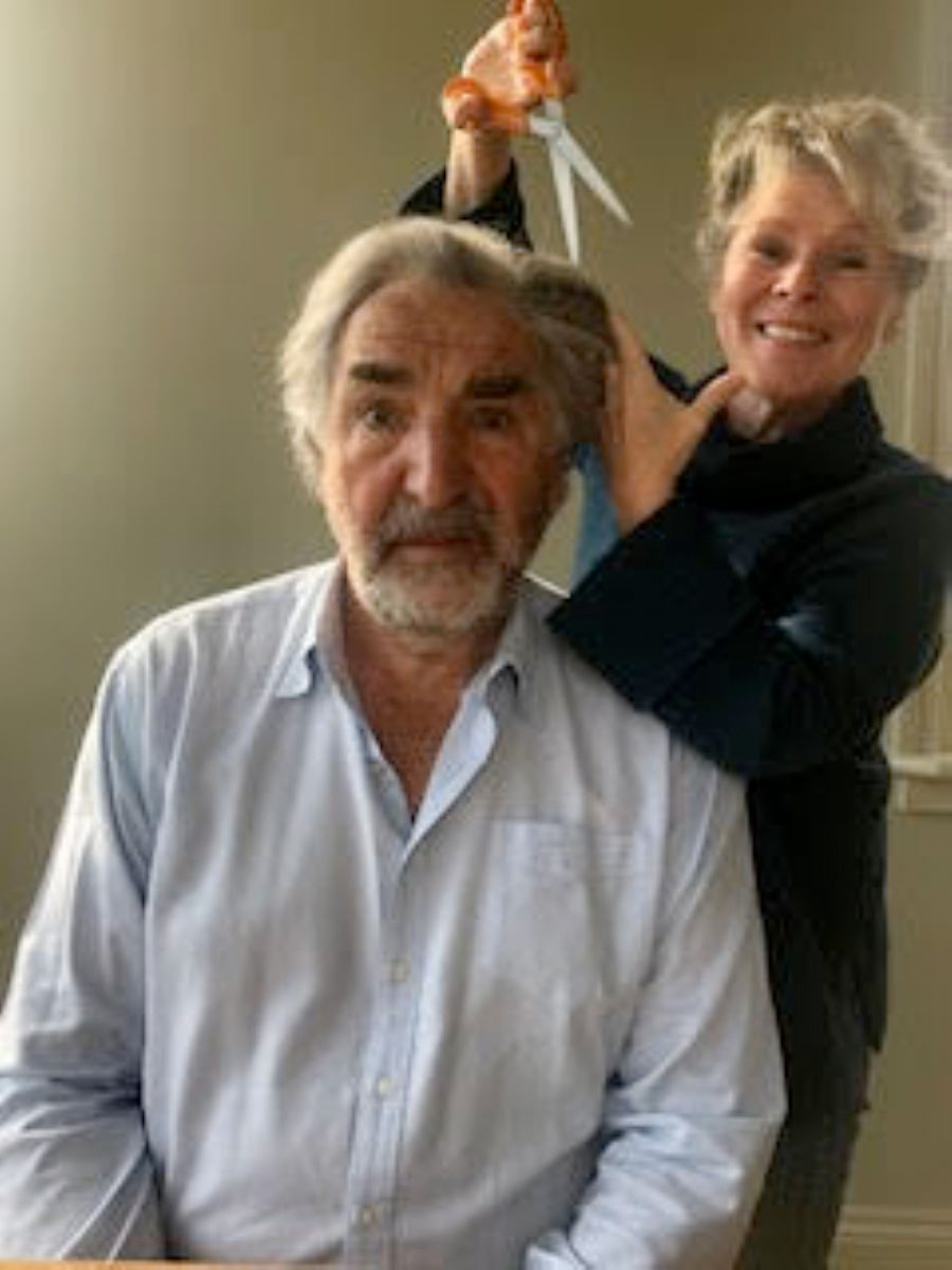 Imelda Staunton helps to style her husband Jim Carter's hair while promoting the work of The Little Princess Trust. 