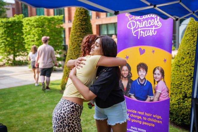 Jemma (left) and Kiya (right) sharing a heartfelt moment at their event
