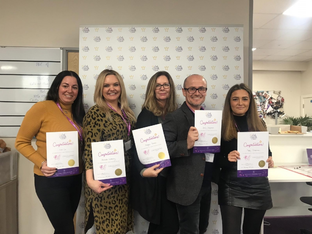 LPT Salon worshop attendees proudly showing their certificates