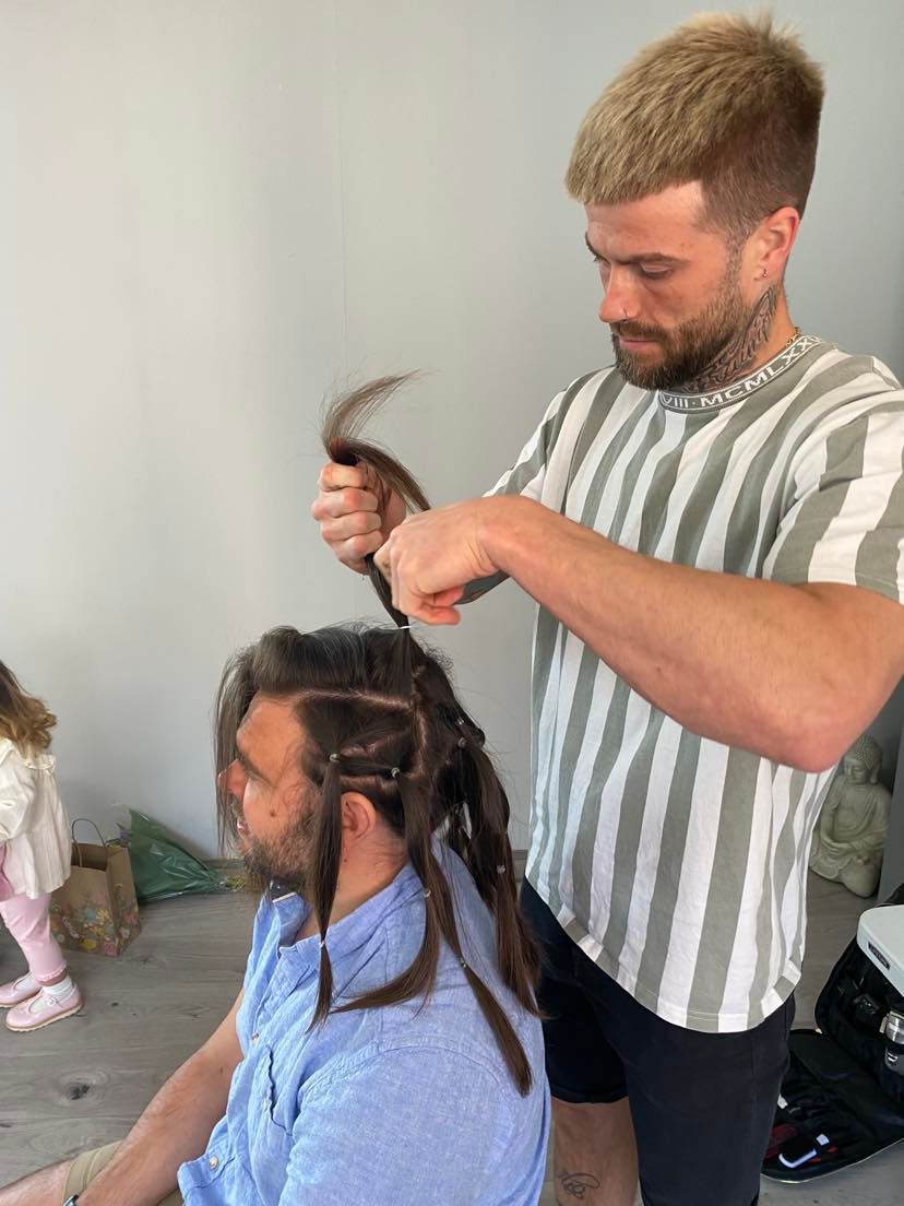 Lee Handford cuts Adam's long locks.