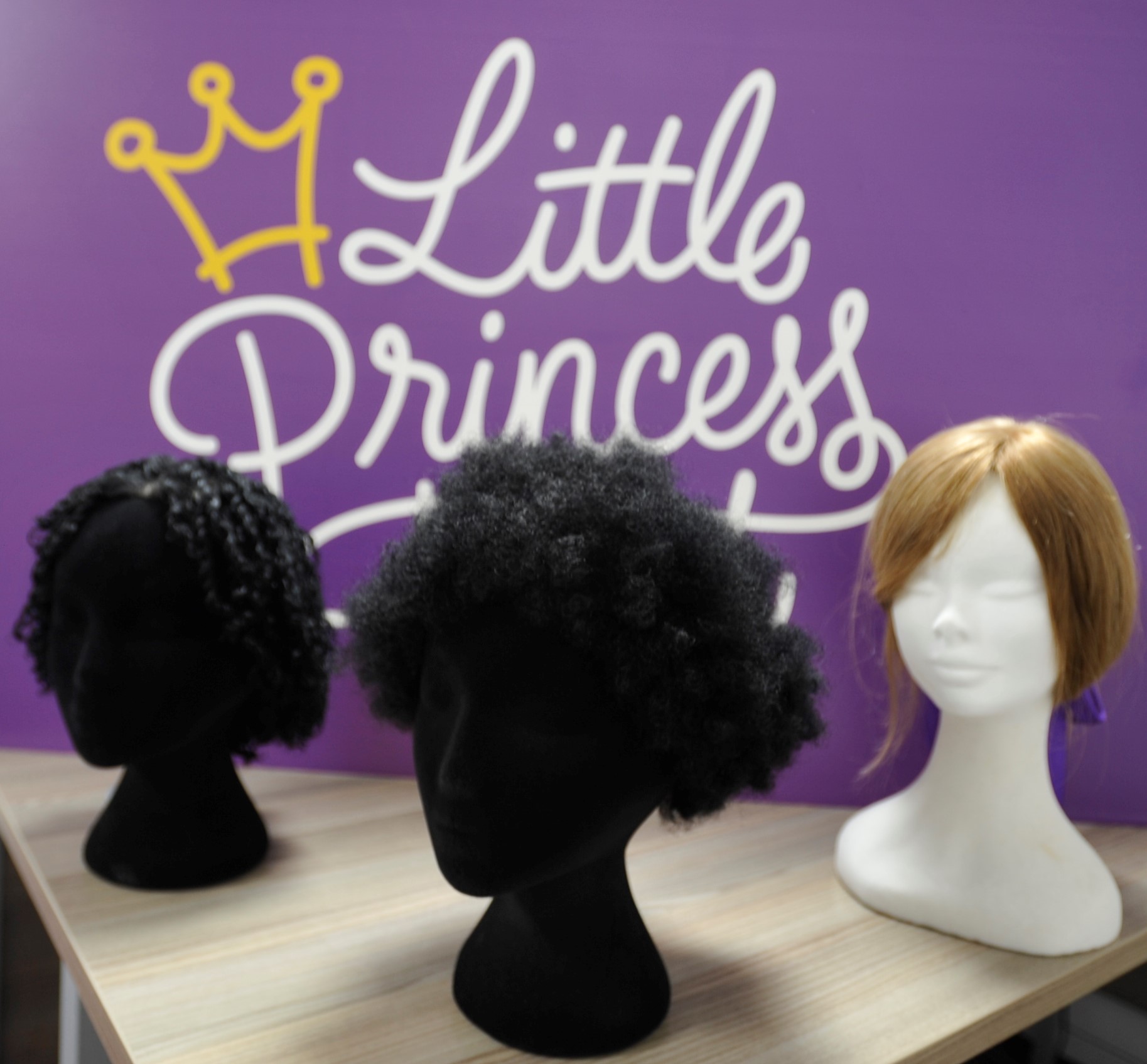 The Little Princess Trust has always offered Afro style wigs such as these here. But these were made from straight hair before being put into the desired style. The new breakthrough means we can make wigs from Afro hair donations.