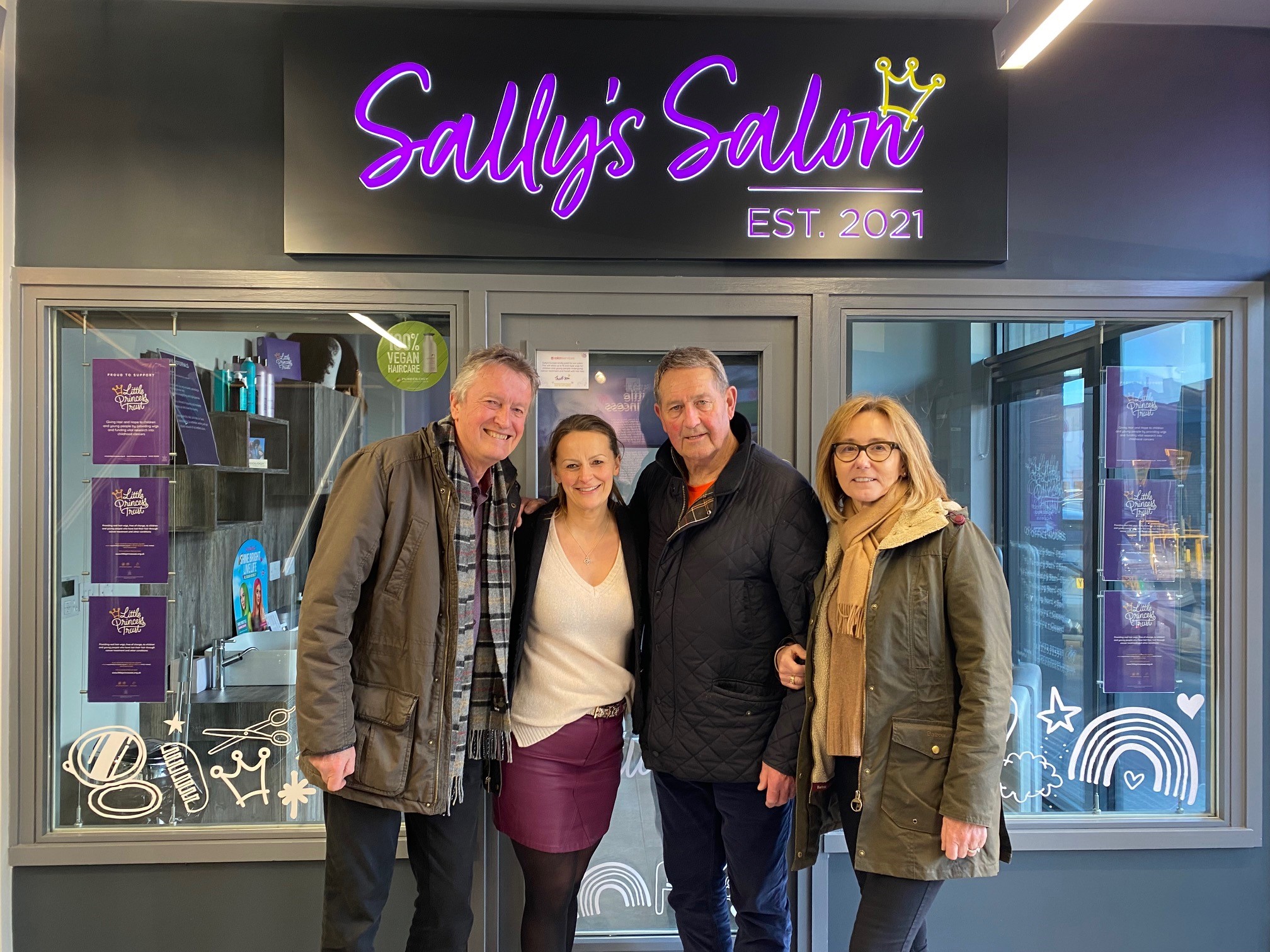 Outside Sally's Salon are (l-r) LPT trustee Tim Lowe, LPT founder Wendy Tarplee-Morris and Graham Gooch and his partner Julia.