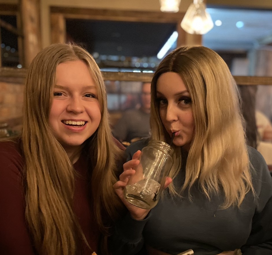 Lauren, right, said her wig gave her the confidence to continue to socialise as a student.