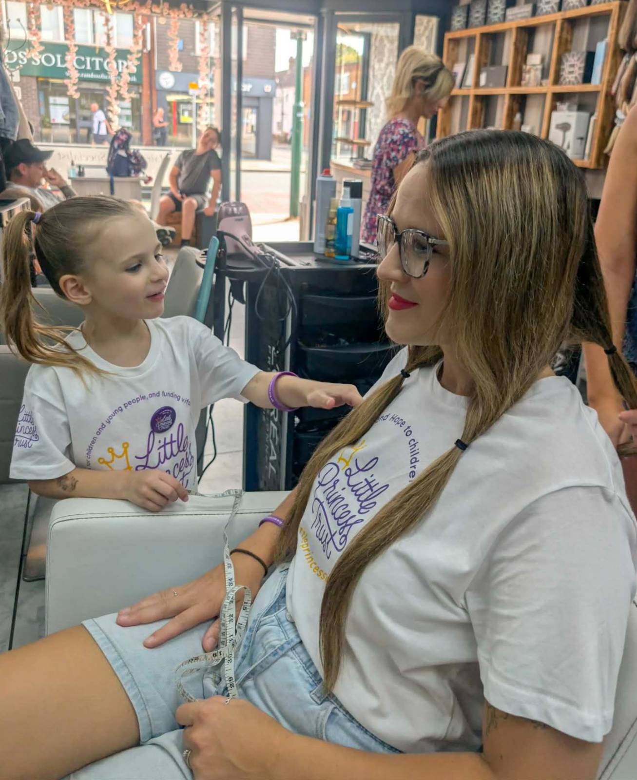 Nina helped to prepare her mum's hair before the big cut.