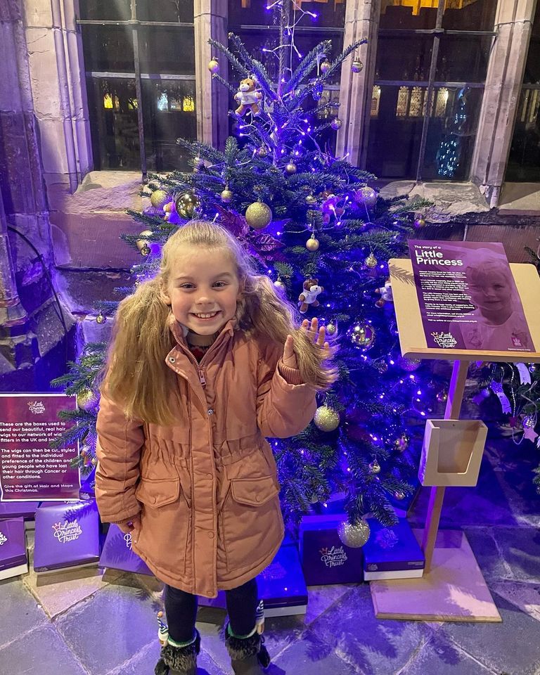 Phoebe in front of our Christmas Tree 