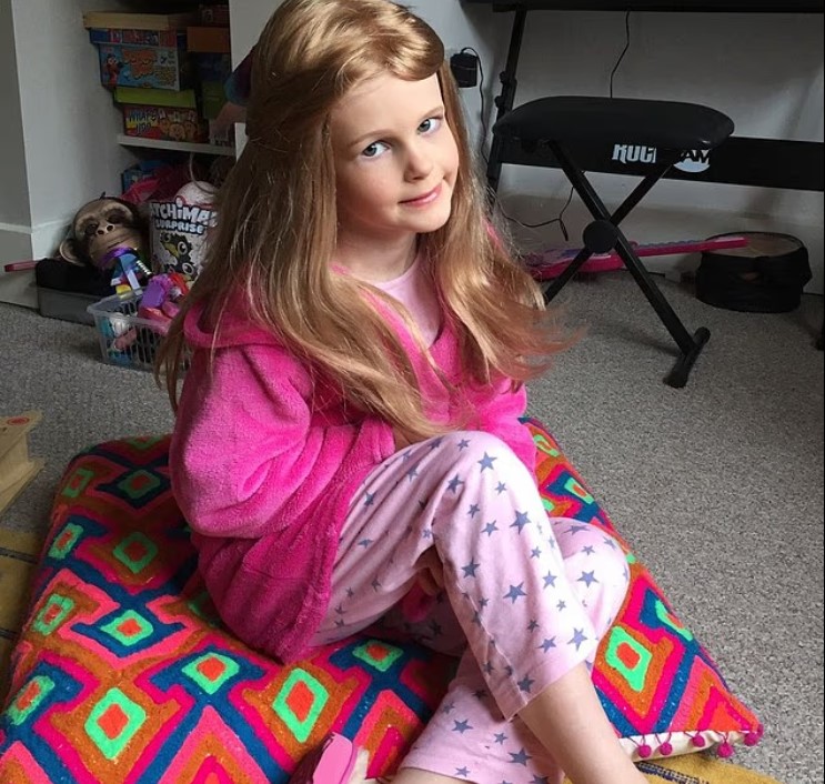 Seren wearing her wig from The Little Princess Trust.