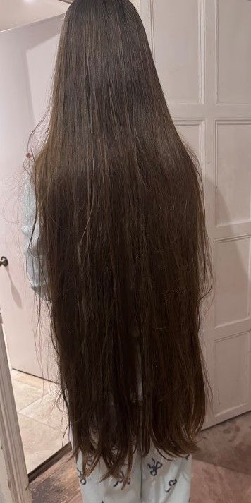 Seren pictured before her hair cut last week when she donated 18 inches of hair.