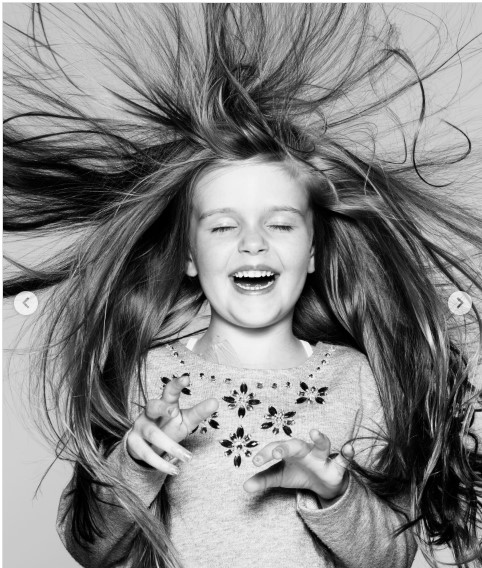 Seren loved the long hair she lost to cancer treatment. The photographer, Rankin, was commissioned by Macmillan to take pictures as part of their Brave the Shave campaign. 