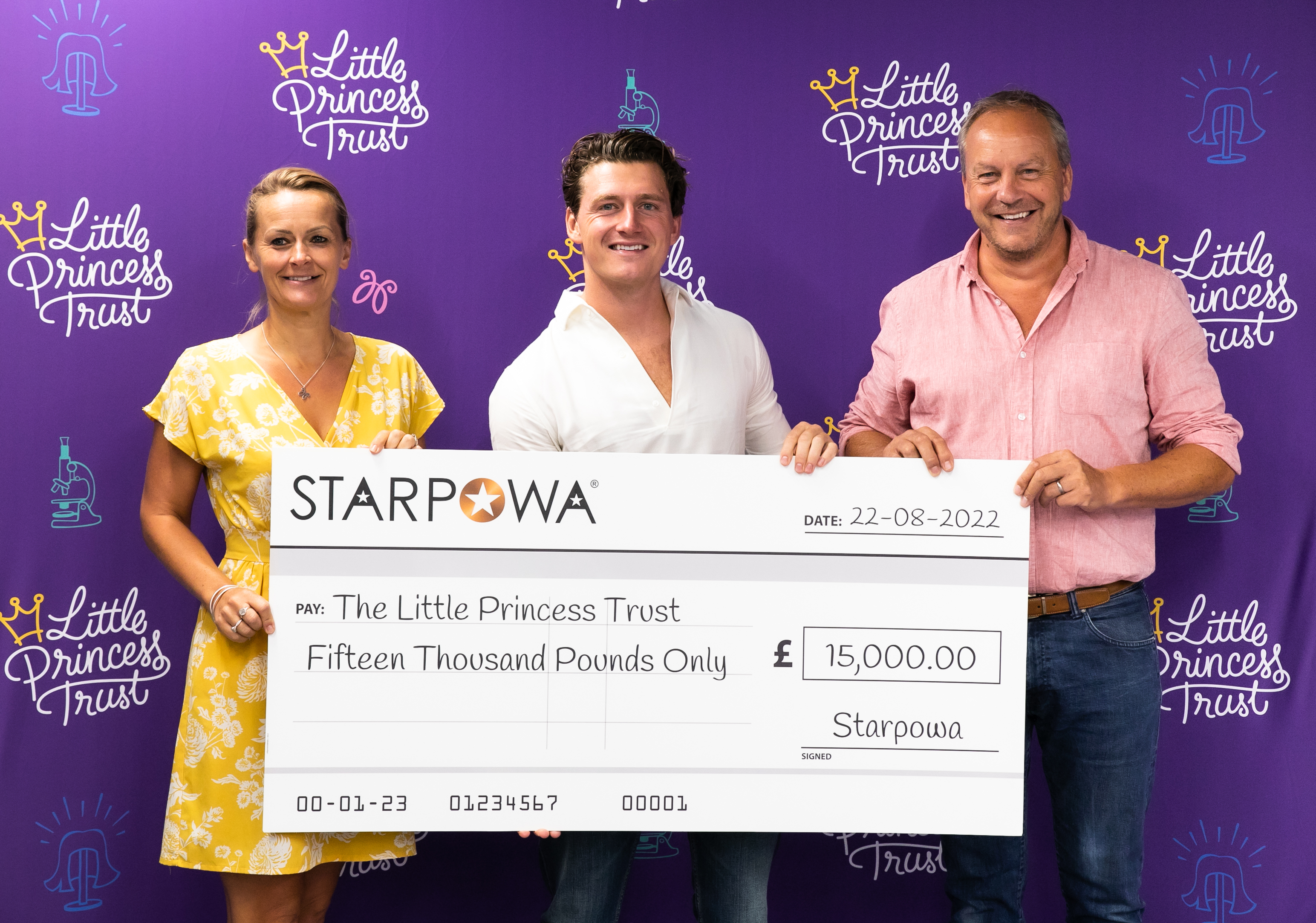 Johnny Gallagher (centre) presents a cheque of £15,000 to The Little Princess Trust to Wendy Tarplee-Morris and Phil Brace.