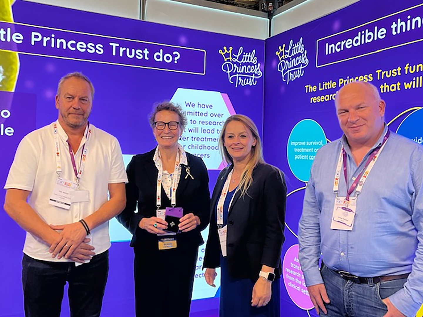 Phil Wendy and Simon from The Little Princess Trust pictured with Kathy Pritchard-Jones Is President of SIOP and Professor of Paediatric Oncology at University College London (UCL) Great Ormond Street Institute of Child Health. London, UK